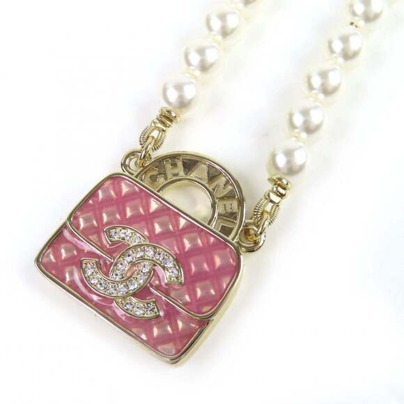 CHANEL Jewelry - CHANEL Pink Pearl Logo Necklace